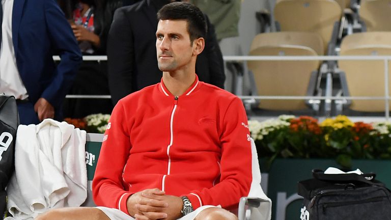 Novak Djokovic of Serbia sits down following defeat in his Men&#39;s Singles Final against Rafael Nadal of Spain on day fifteen of the 2020 French Open at Roland Garros on October 11, 2020 in Paris, France