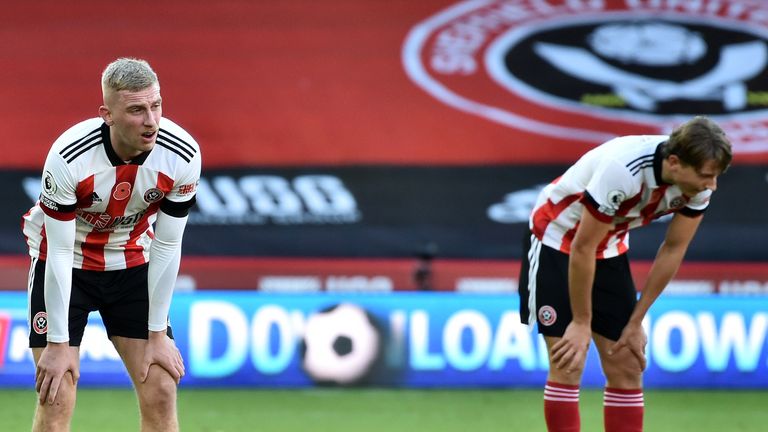 A deflated Oli McBurnie and Sander Berge after Sheffield United suffer a sixth defeat in seven