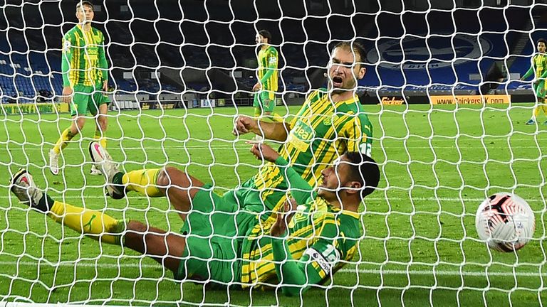 West Brom defender Branislav Ivanovic hits the ball into midfielder Jake Livermore and then into the net for an own-goal 1-0 to Brighton