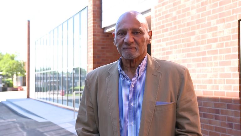 Paul stands outside the building named after him at Fernwood School