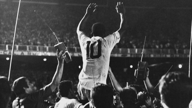 Pele is lifted up by his Santos team mates after scoring the 1,000th goal of his career during a game against Vasco da Gama at the Maracana Stadium, Rio de Janeiro, Brazil, 19th November 1969.