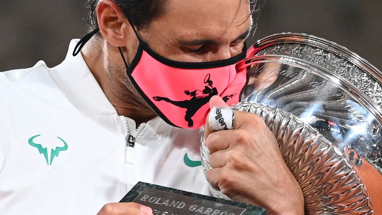 Spain&#39;s Rafael Nadal kisses the Mousquetaires Cup (The Musketeers) as he celebrates during the podium ceremony after winning the men&#39;s singles final tennis match against Serbia&#39;s Novak Djokovic at the Philippe Chatrier court, on Day 15 of The Roland Garros 2020 French Open tennis tournament in Paris on October 11, 2020