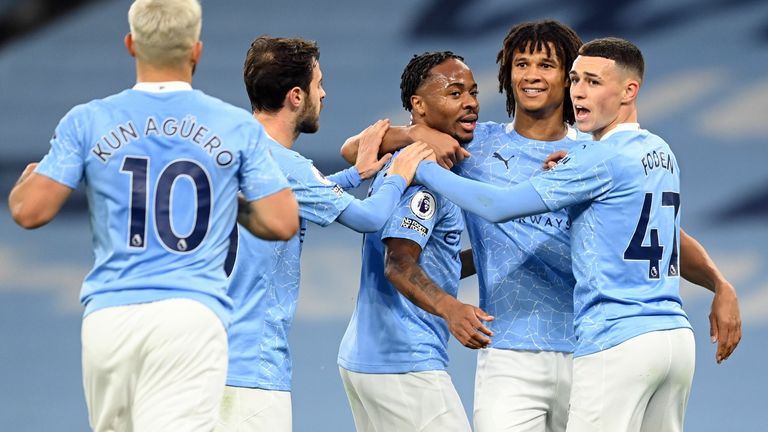 Raheem Sterling celebrates scoring the opening goal of the game with team-mates