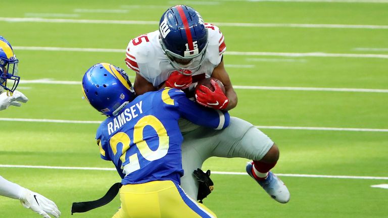 Jalen Ramsey of the Los Angeles Rams tackles Golden Tate of the New York Giants