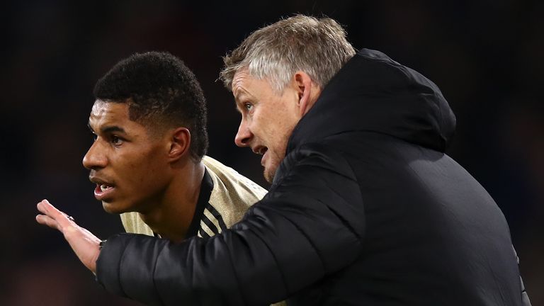Marcus Rashford of Manchester United and Ole Gunnar Solskjaer the head coach / manager of Manchester United during the Premier League match between Burnley FC and Manchester United at Turf Moor on December 28, 2019 in Burnley, United Kingdom