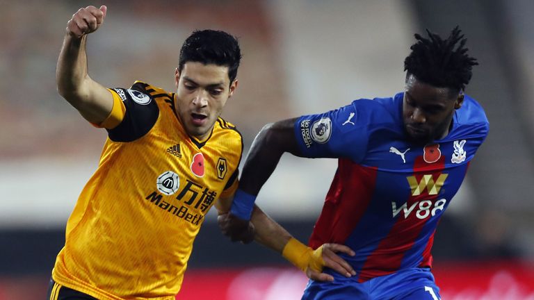 Wolves' Raul Jimenez and Crystal Palace's Jeffrey Schlupp battle for the ball