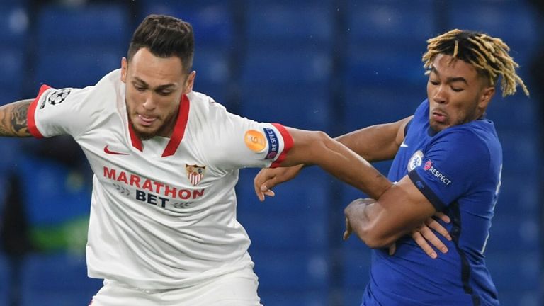 Sevilla midfielder Lucas Ocampos (L) vies with Chelsea's Reece James