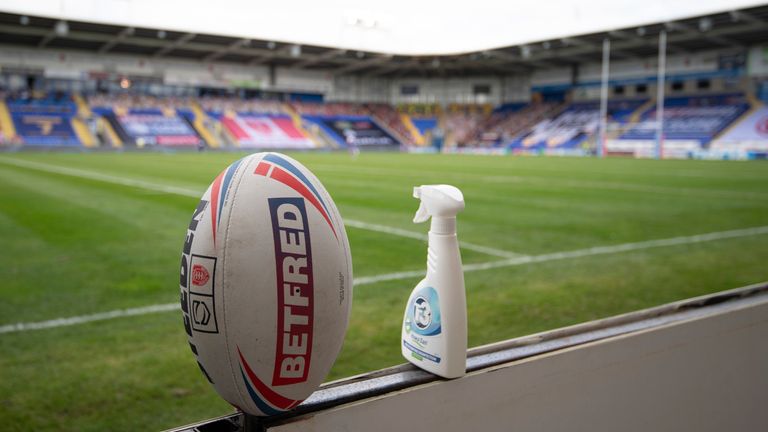 WARRINGTON, ENGLAND - AUGUST 30: A general view of the Betfred Super League match ball next to a bottle of disinfectant during the Betfred Super League match between Hull Kingston Rovers and St Helens at The Halliwell Jones Stadium on August 30, 2020 in Warrington, England. (Photo by George Wood/Getty Images)