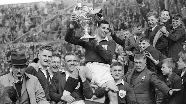 7th May 1938: Team Captain Gus Risman is chaired by team-mates with the trophy after Salford beat Barrow to win the Rugby League Challenge Cup at Wembley Stadium. (Photo by Dennis Oulds/Central Press/Getty Images)