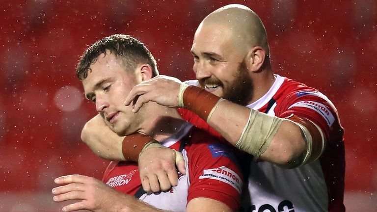 Salford's Joey Lussick celebrates his try with Gil Dudson