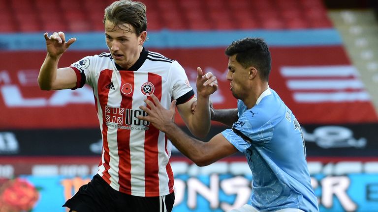 SHEFFIELD, ENGLAND - OCTOBER 31: Sander Berge of Sheffield United is challenged by Rodri of Manchester City during the Premier League match between Sheffield United and Manchester City at Bramall Lane on October 31, 2020 in Sheffield, England.