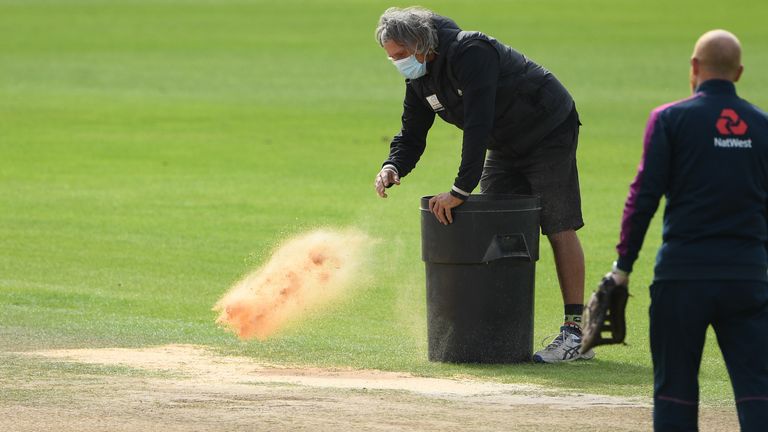 SOUTHAMPTON, ENGLAND - AUGUST 25: A member of the ground staff puts sawdust on the pitch prior to Day Five of the 3rd #RaiseTheBat Test Match between England and Pakistan at the Ageas Bowl on August 25, 2020 in Southampton, 