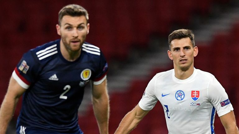 Scotland's Stephen O'Donnell and Slovakia's Jakub Holubek in action