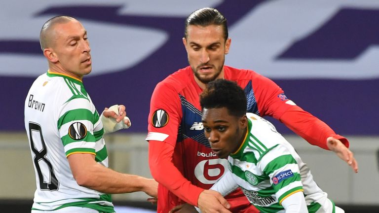 Lille Yusuf Yazici (C) vies for the ball with Celtic duo Scott Brown and Jeremie Frimpong