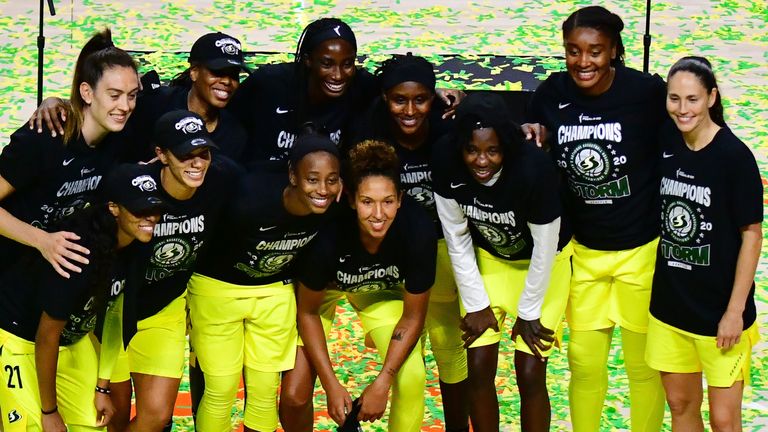 The Seattle Storm players pose with the  trophy after being crowned WNBA champions