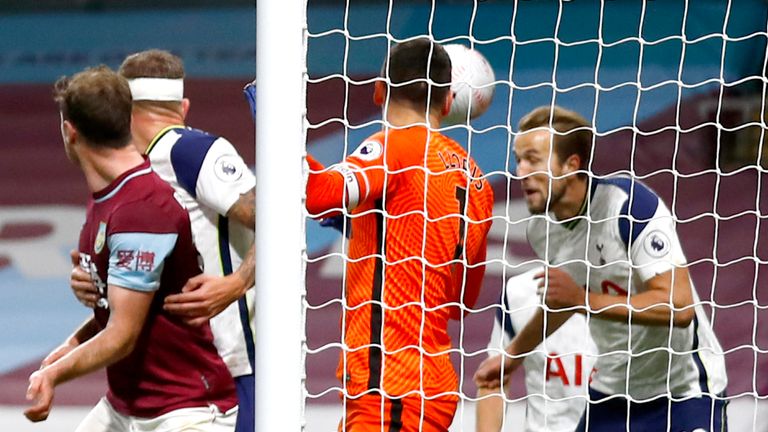 Harry Kane of Tottenham Hotspur clears the ball off the line from James Tarkowski of Burnley