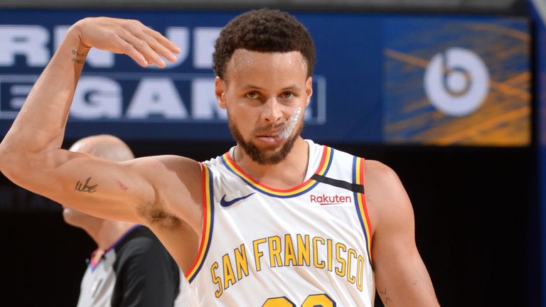 Stephen Curry celebrates a basket during a Warriors'  regular-season game in March 2020