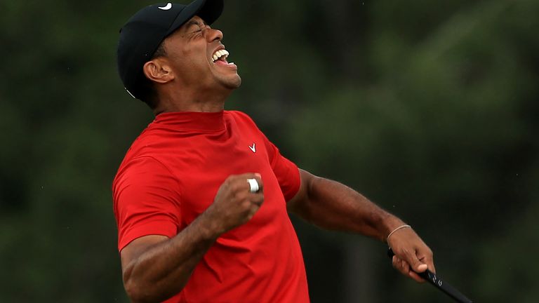 Tiger Woods raised his arms after clinching his 15th major victory at Augusta National