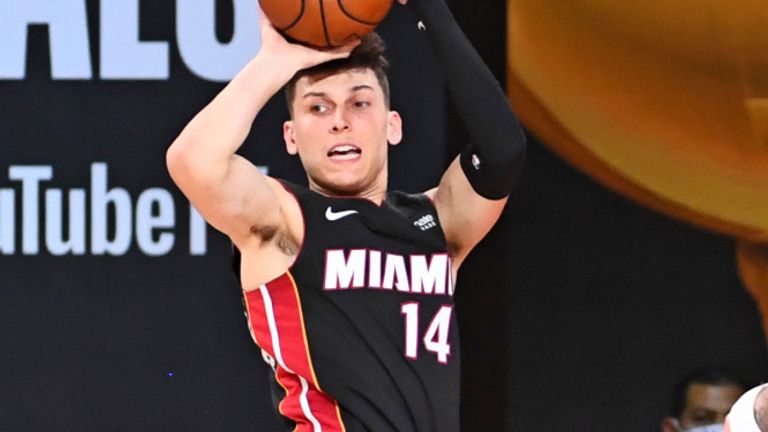 Miami Heat rookie Tyler Herro throws a mid-air pass during Game 4 of the NBA Finals
