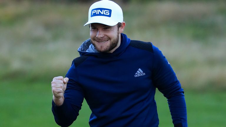 Tyrrell Hatton celebrates confirming victory on the 18th green