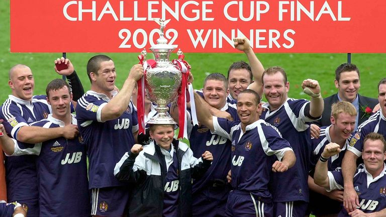 Pix: Ben Duffy/SWpix.com. Kelloggs Nutri-Grain Challenge Cup Final-Edinburgh...Wigan Warriors v St Helens..... 27/04/2002...COPYWRIGHT PICTURE>>SIMON WILKINSON>>01943 436649>>..Wigan's team celebrate their challenge cup victory, Andy Farrell balancing the cup on his sons head