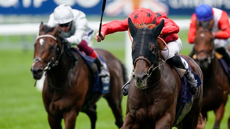 Pierre-Charles Boudot riding The Revenant (red) win The Queen Elizabeth II Stakes