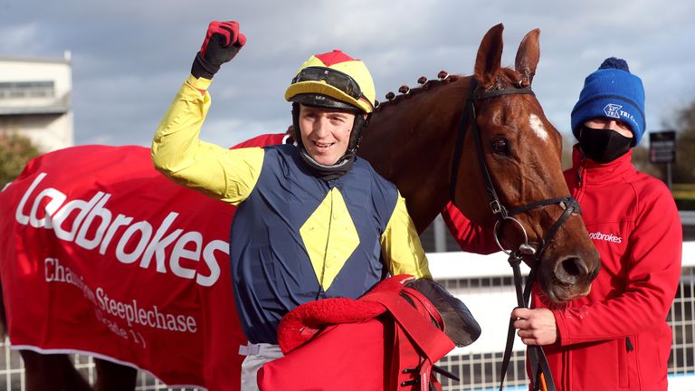 Jockey Keith Donoghue celebrates after winning the Ladbrokes Champion Chase on The Storyteller at Down Royal Racecourse.