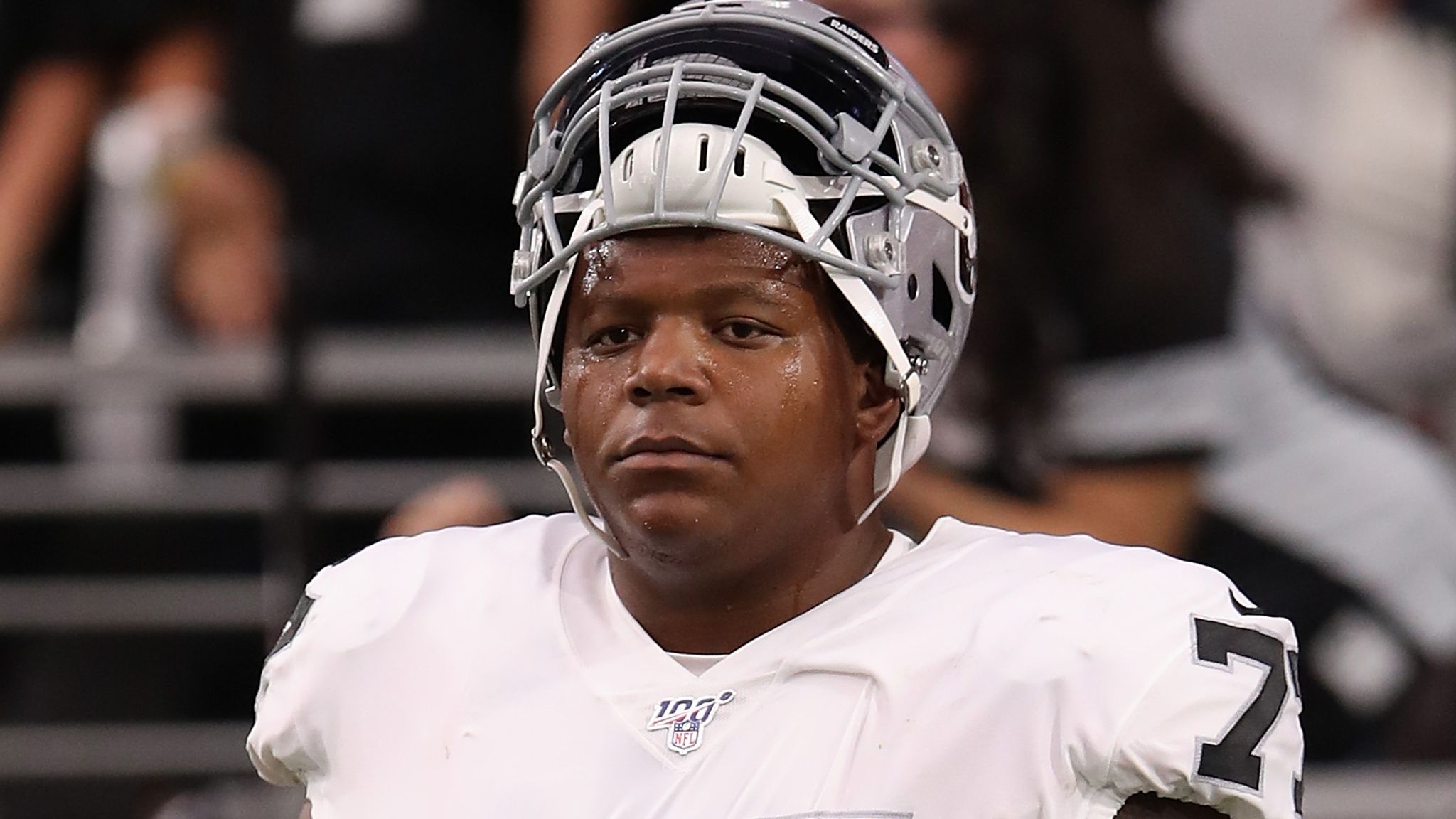 Las Vegas Raiders offensive tackle Trent Brown (77) walks off the