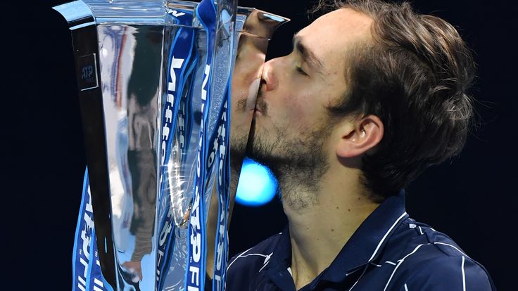 Daniil Medvedev kisses the winner's trophy after his 4-6, 7-6, 6-4 win over Austria's Dominic Thiem in their men's singles final match on day eight of the ATP World Tour Finals tennis tournament at the O2 Arena in London on November 22, 2020.