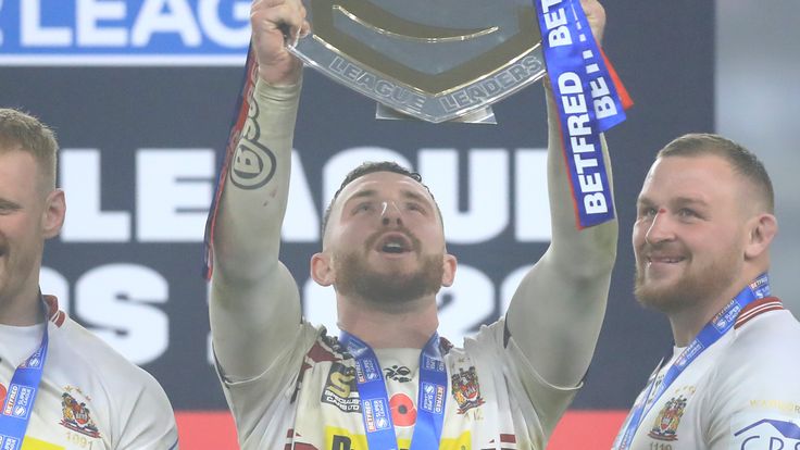 LEEDS, ENGLAND - NOVEMBER 06: Jackson Hastings of Wigan Warriors lifts the League Leaders' Shield in celebration with his teammates after the Betfred Super League match between Wigan Warriors and Huddersfield Giants at Emerald Headingley Stadium on November 06, 2020 in Leeds, England. 