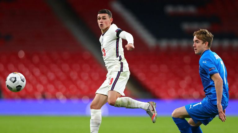 Phil Foden of England and Isak Bergmann Johannesson of Iceland in action during the UEFA Nations League group stage match between England and Iceland at Wembley Stadium on November 18, 2020 in London, England
