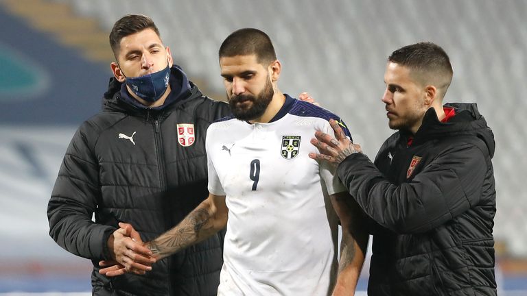 Aleksandar Mitrovic is consoled after his decisive missed penalty