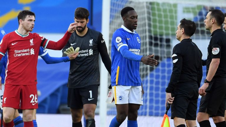 Andrew Robertson berates the officials after he gave away a last-gasp penalty