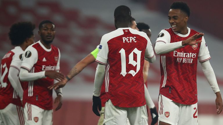 Arsenal players celebrate after taking the lead against Molde