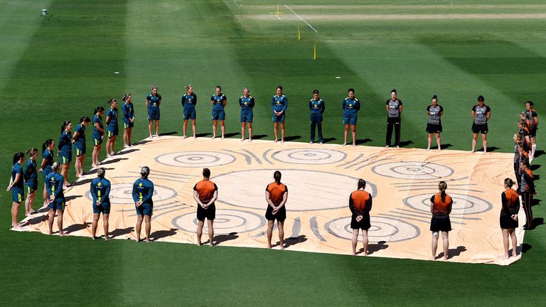 Players from both teams stand in solidarity for 'Close The Gap' in awareness to the gap between Indigenous and Non Indigenous Australians, before game one of the T20 Women's International series between Australia and New Zealand at Allan Border Field on September 26, 2020 in Brisbane, Australia. (Photo by Bradley Kanaris/Getty Images)