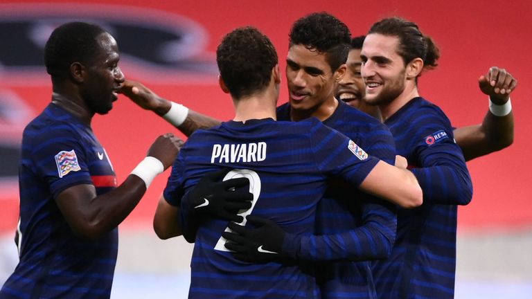 Benjamin Pavard celebrates with France team-mates after scoring against Sweden