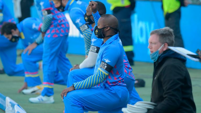 ABs Eagles' Lungi Ngidi (2nd R) takes a knee in solidarity with the global Black Lives Matter movement ahaed of the 3TC Solidarity Cup cricket match between KGs Kingfishers, Quinnys Kites and ABs Eagles at the SuperSport Park in Centurion on July 18, 2020. (Photo by Christiaan Kotze / AFP) (Photo by CHRISTIAAN KOTZE/AFP via Getty Images)