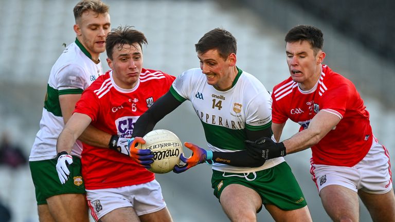 Conor Sweeney of Tipperary is tackled by Sean Meehan and Maurice Shanley of Cork