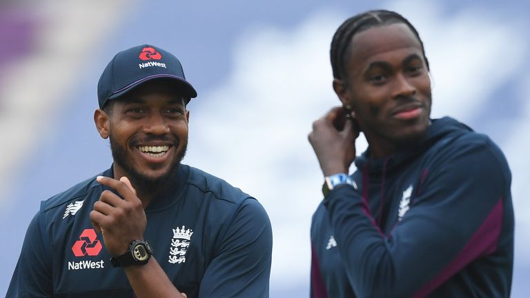 England team-mates Chris Jordan (L) and Jofra Archer