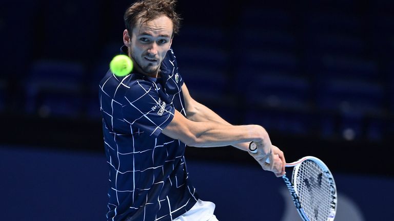 Daniil Medvedev returns to Serbia's Novak Djokovic during their men's singles round-robin match on day four of the ATP World Tour Finals tennis tournament at the O2 Arena in London on November 18, 2020. 