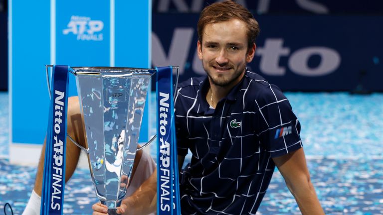 Daniil Medvedev of Russia poses with the trophy after winning his singles final match against Dominic Thiem of Austria during day eight of the Nitto ATP World Tour Finals at The O2 Arena on November 22, 2020 in London, England.
