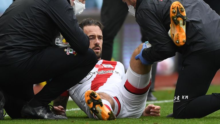 Danny Ings receives treatment for an injury late in the second half 