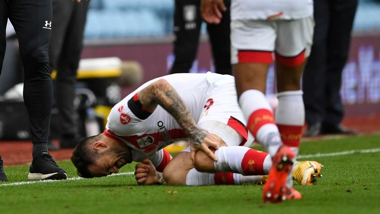 Danny Ings goes to ground clutching his knee