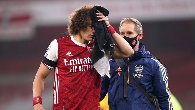 David Luiz of Arsenal receives medical treatment after a collision with Raul Jimenez of Wolverhampton Wanderers (not pictured) during the Premier League match between Arsenal and Wolverhampton Wanderers at Emirates Stadium on November 29, 2020 in London, England.