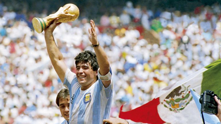 Diego Maradona of Argentina holds the World Cup trophy after defeating West Germany 3-2 during the 1986 FIFA World Cup Final match at the Azteca Stadium on June 29, 1986 in Mexico City, Mexico