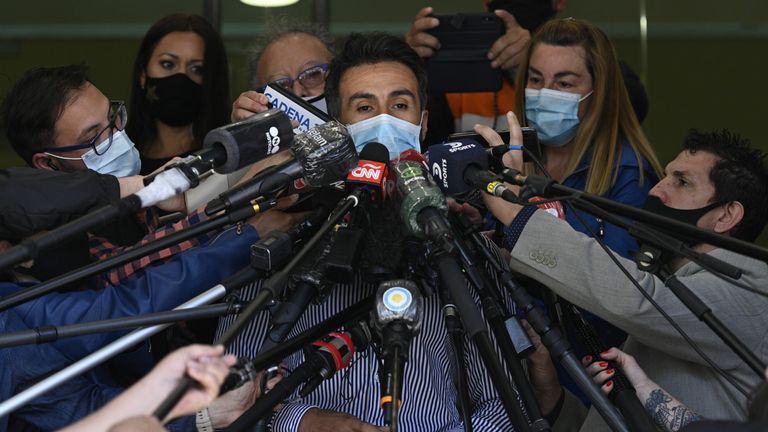 Leopoldo Luque, the personal physician of Argentine former football star and coach of Gimnasia y Esgrima La Plata Diego Maradona, gives a medical report outside the private clinic where he underwent a brain surgery for a blood clot