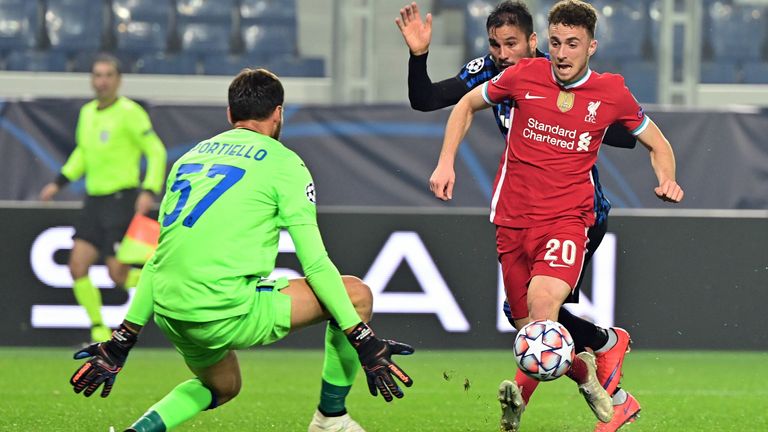 Diogo Jota chips over Atalanta goalkeeper Marco Sportiello to give Liverpool the lead in Italy