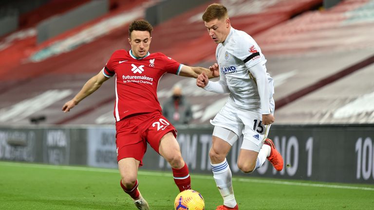 Diogo Jota battles for possession with Harvey Barnes at Anfield