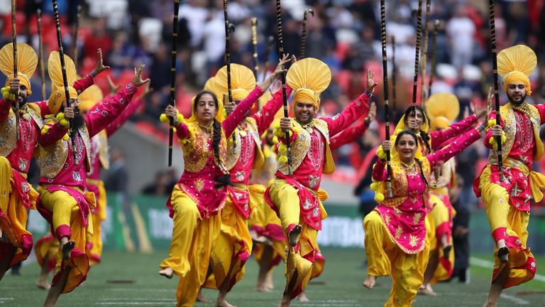 A Diwali Bangra Dance Group perform at half time during the Premier League match between Tottenham Hotspur and AFC Bournemouth at Wembley Stadium on October 14, 2017 in London, England