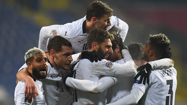 Domenico Berardi celebrates with team-mates after scoring Italy's second goal against Bosnia & Herzegovina